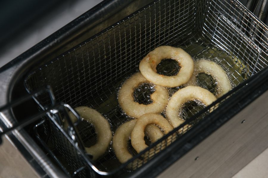 Crispy onion rings frying